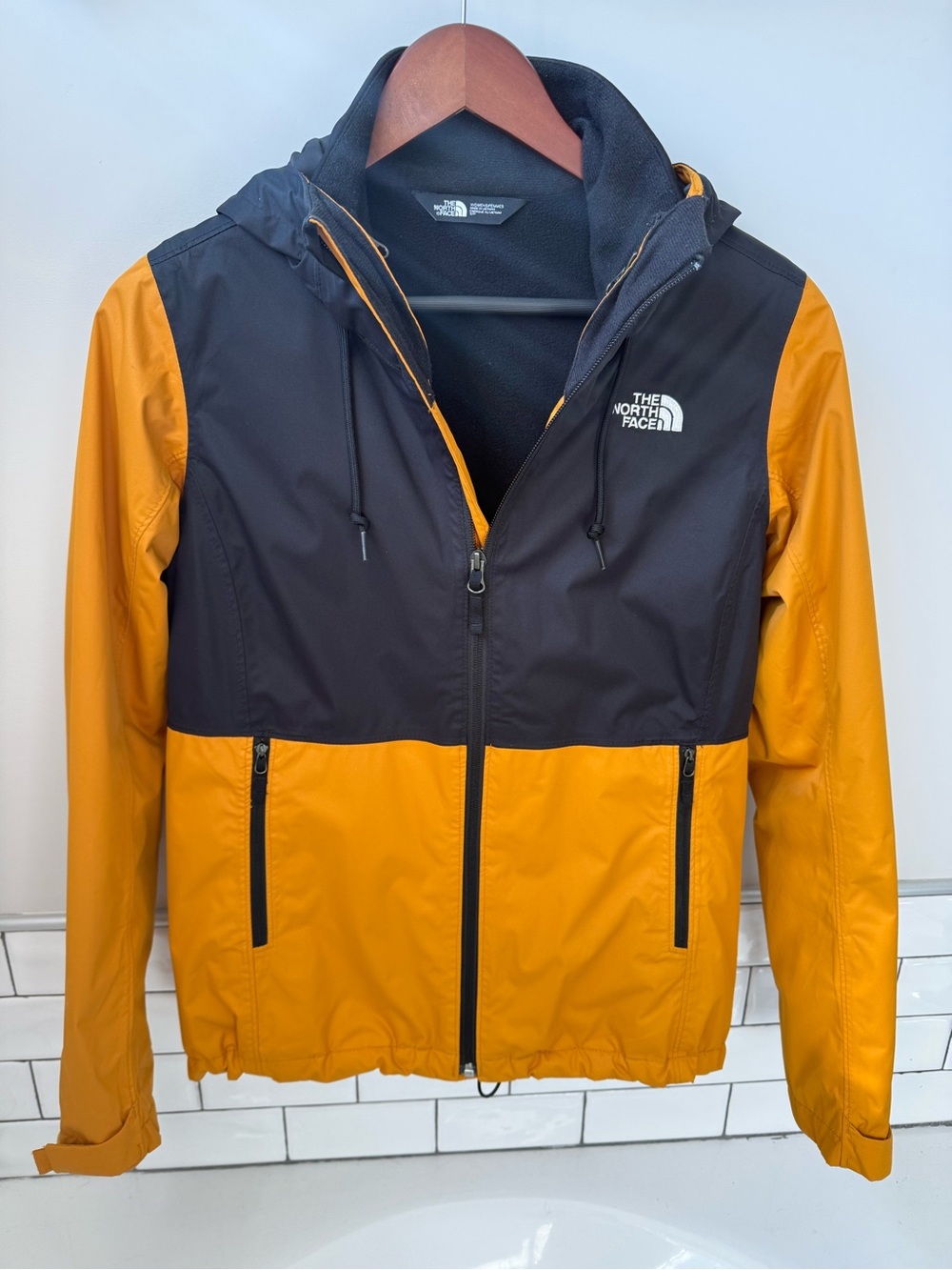 The North Face Men’s Black and Mustard Hooded Windbreaker